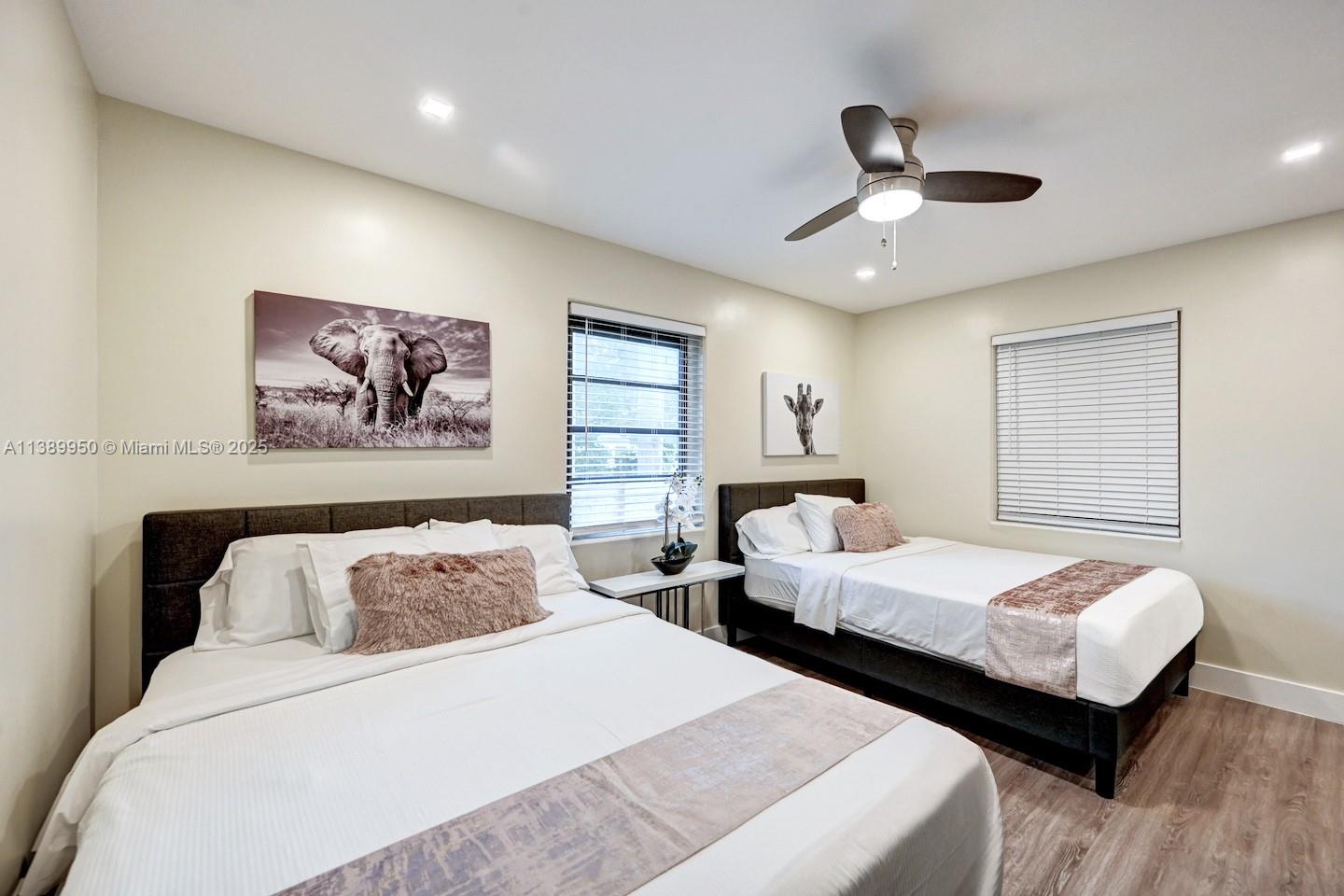 801 Harrison Street Hollywood, FL 33019 - Photo 30 of 46 a bedroom with two beds and painting on the wall