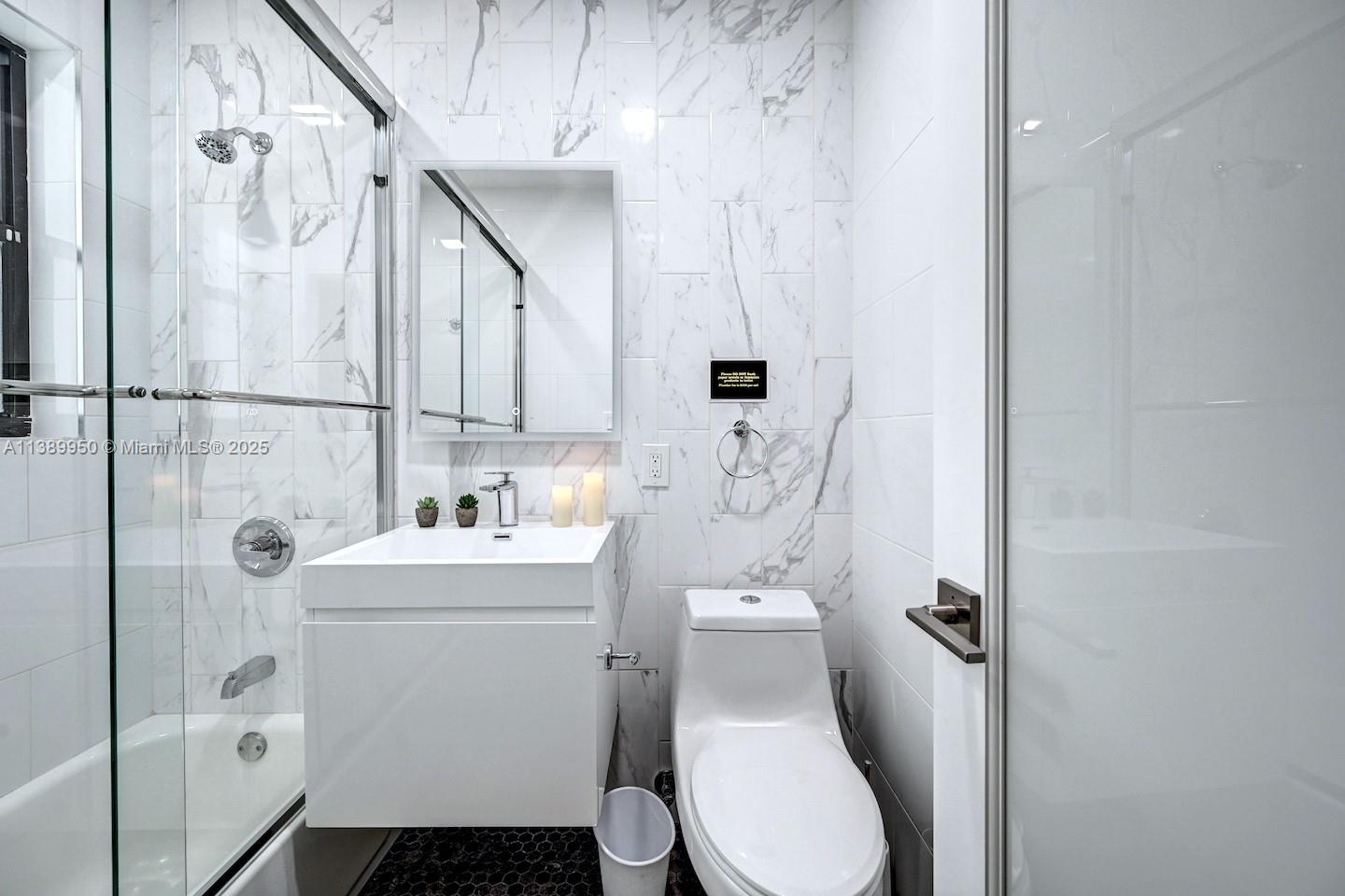 801 Harrison Street Hollywood, FL 33019 - Photo 32 of 46 a bathroom with a sink toilet and shower