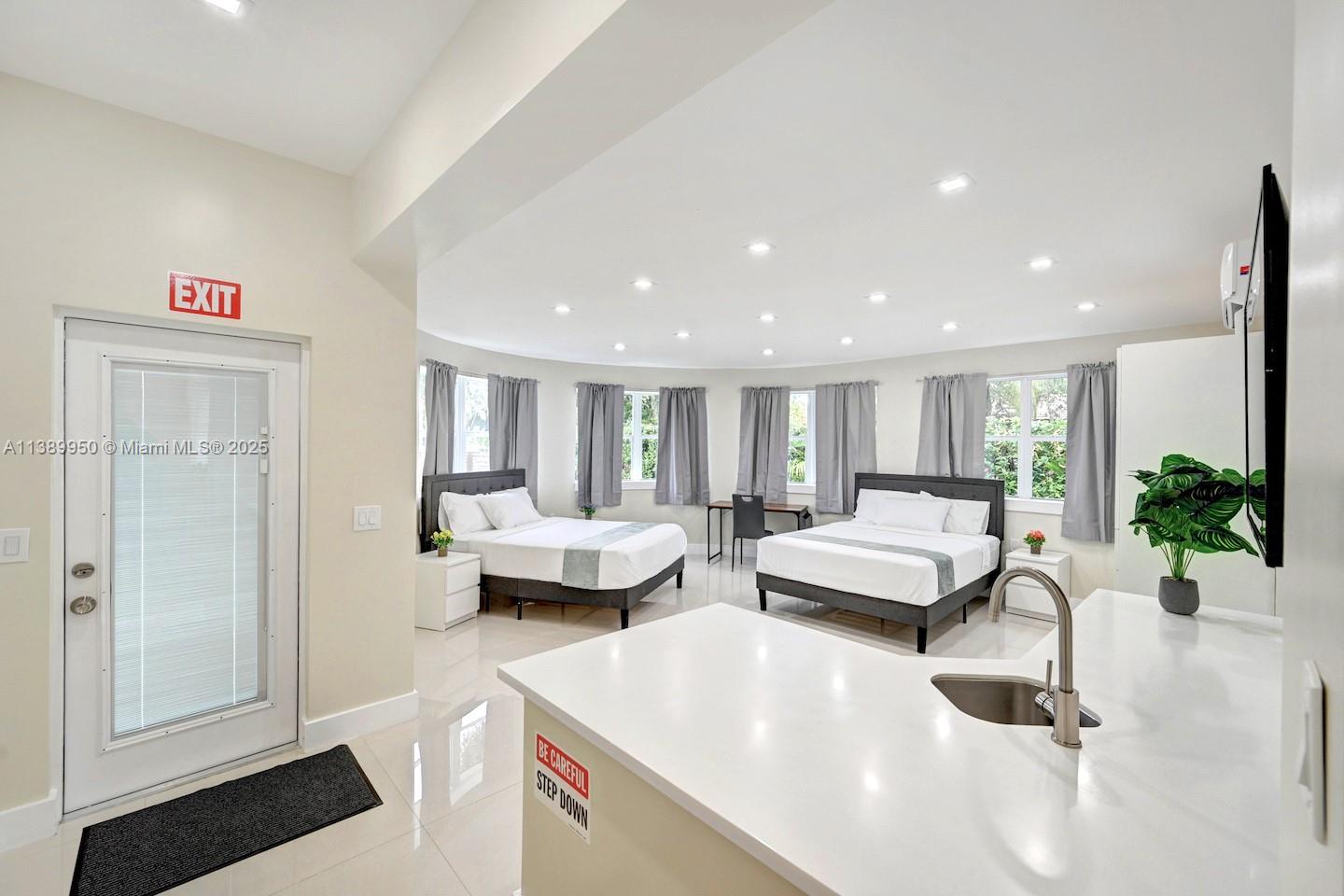 801 Harrison Street Hollywood, FL 33019 - Photo 38 of 46 a living room with furniture and a table