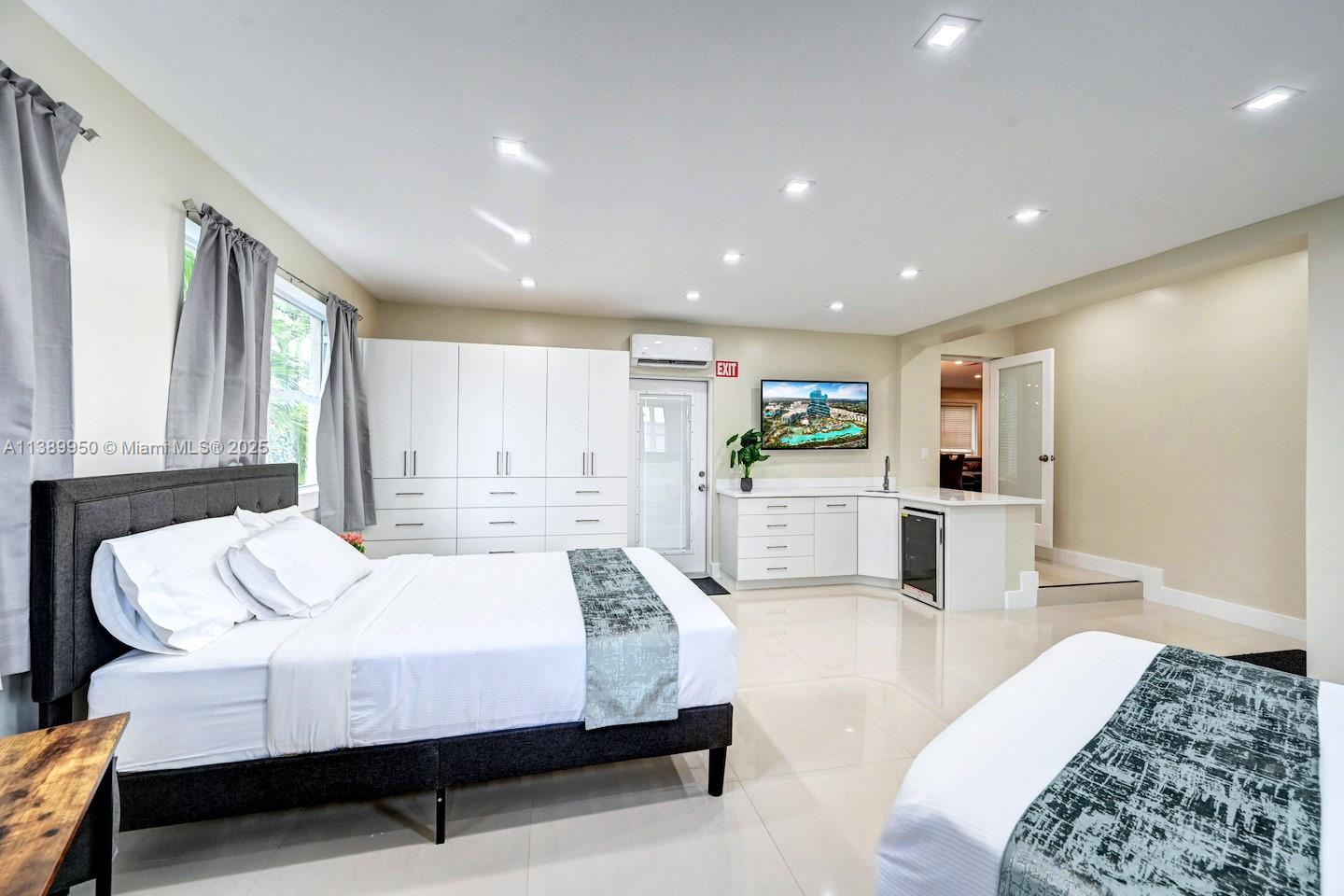 801 Harrison Street Hollywood, FL 33019 - Photo 40 of 46 a bedroom with a bed window and couch