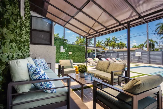 a view of a patio with couches chairs and a table and chairs