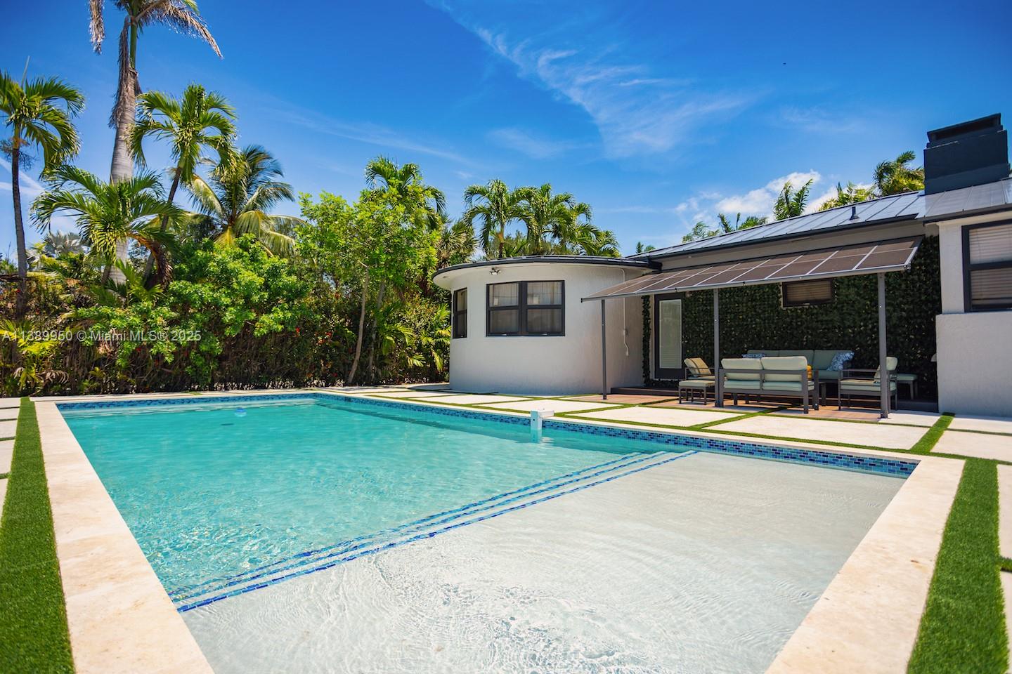 801 Harrison Street Hollywood, FL 33019 - Photo 6 of 46 a view of a house with swimming pool and sitting area