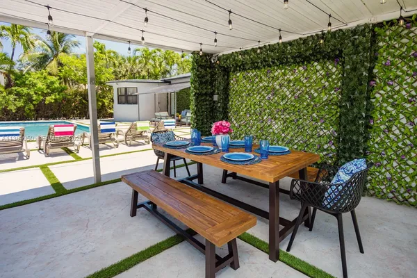 a outdoor dining space with furniture and outdoor view