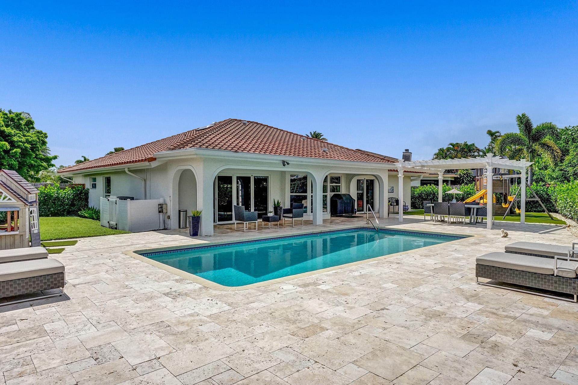 5264 Deerhurst Crescent Circle Boca Raton, FL 33486 - Photo 1 of 62 a view of house and outdoor space with swimming pool and porch