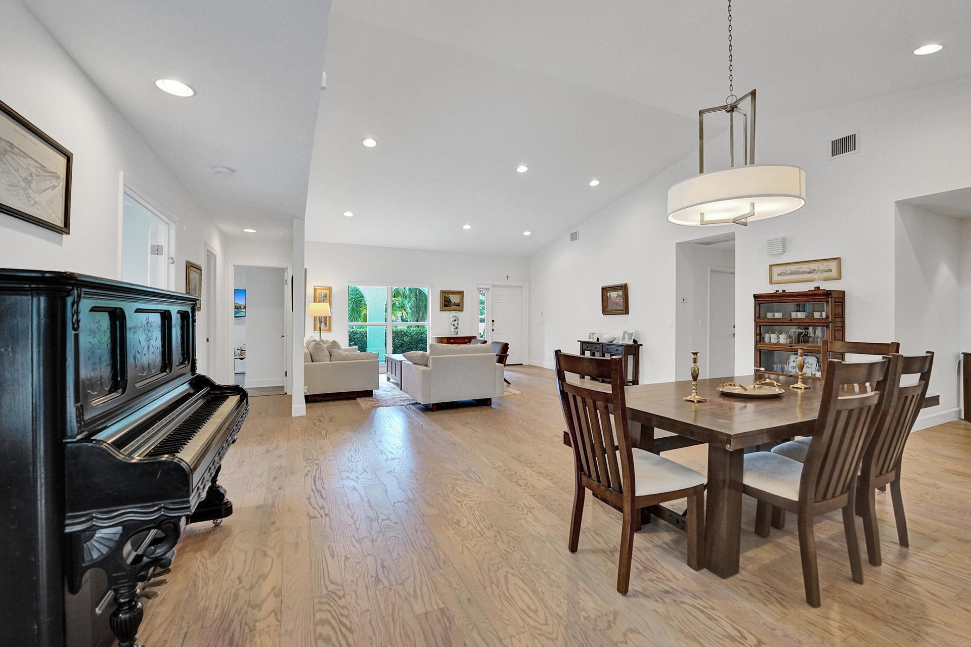 5264 Deerhurst Crescent Circle Boca Raton, FL 33486 - Photo 15 of 62 a view of a dining room with furniture window and wooden floor