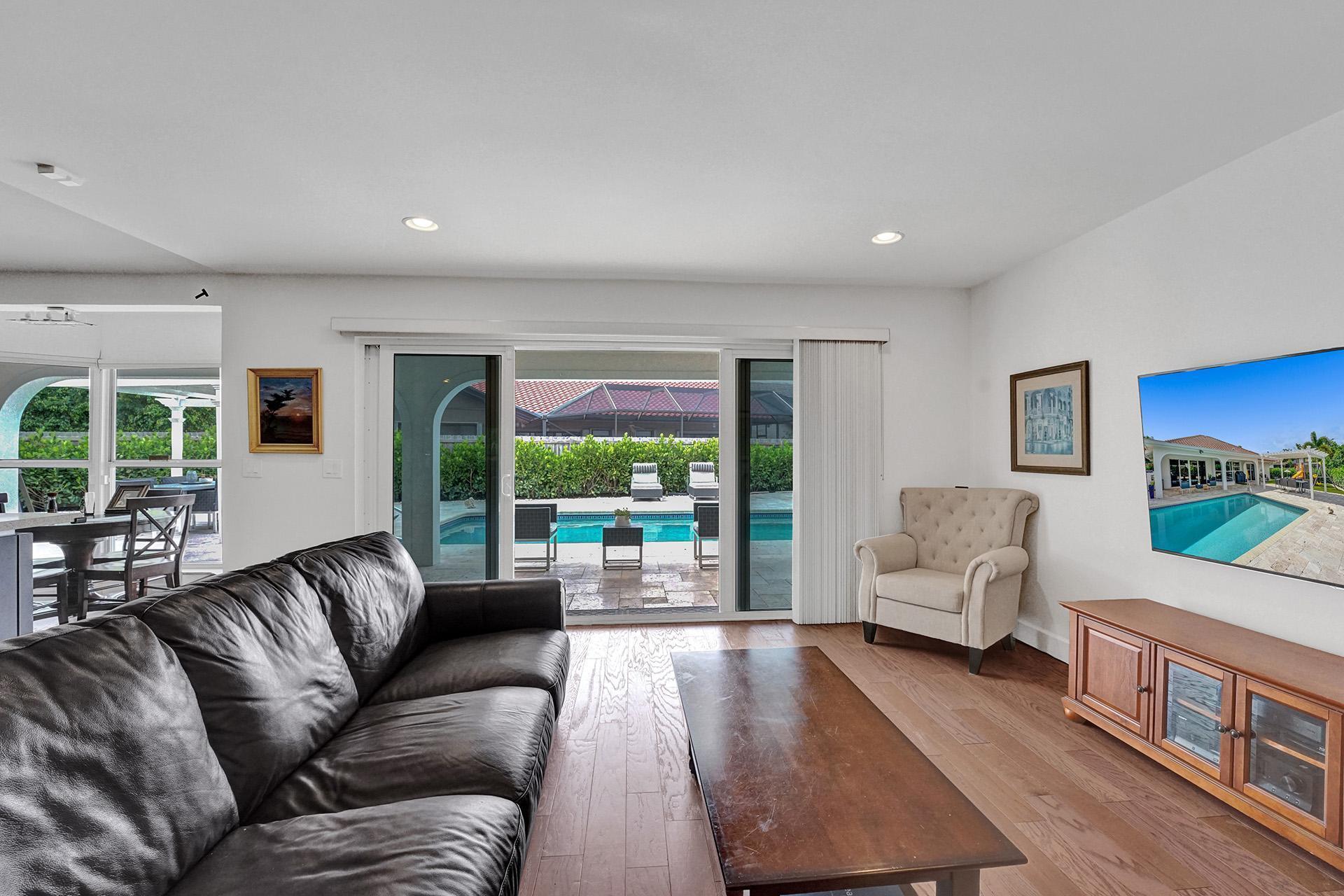 5264 Deerhurst Crescent Circle Boca Raton, FL 33486 - Photo 21 of 62 a living room with furniture and a large window