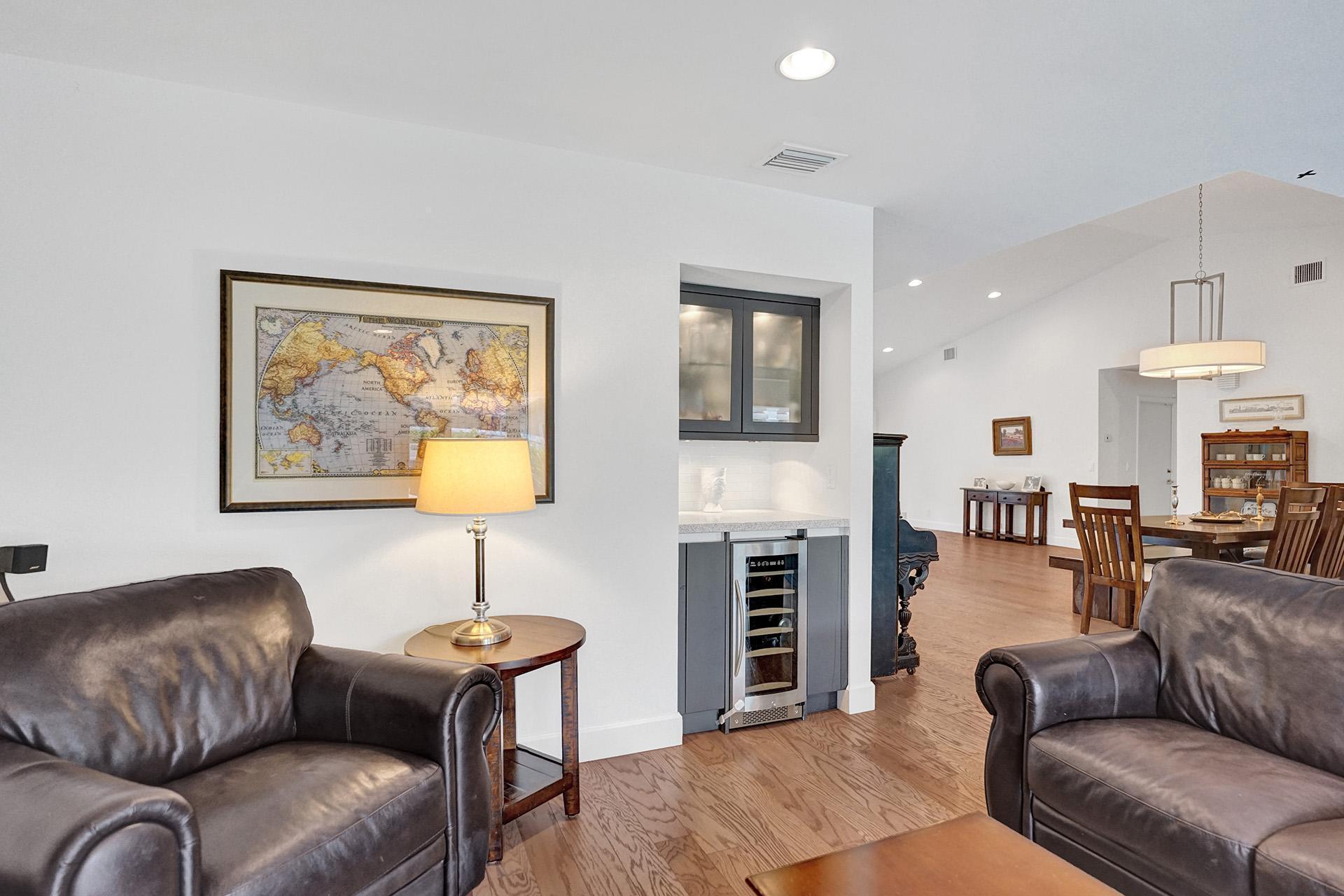 5264 Deerhurst Crescent Circle Boca Raton, FL 33486 - Photo 24 of 62 a living room with furniture a fireplace and a flat screen tv