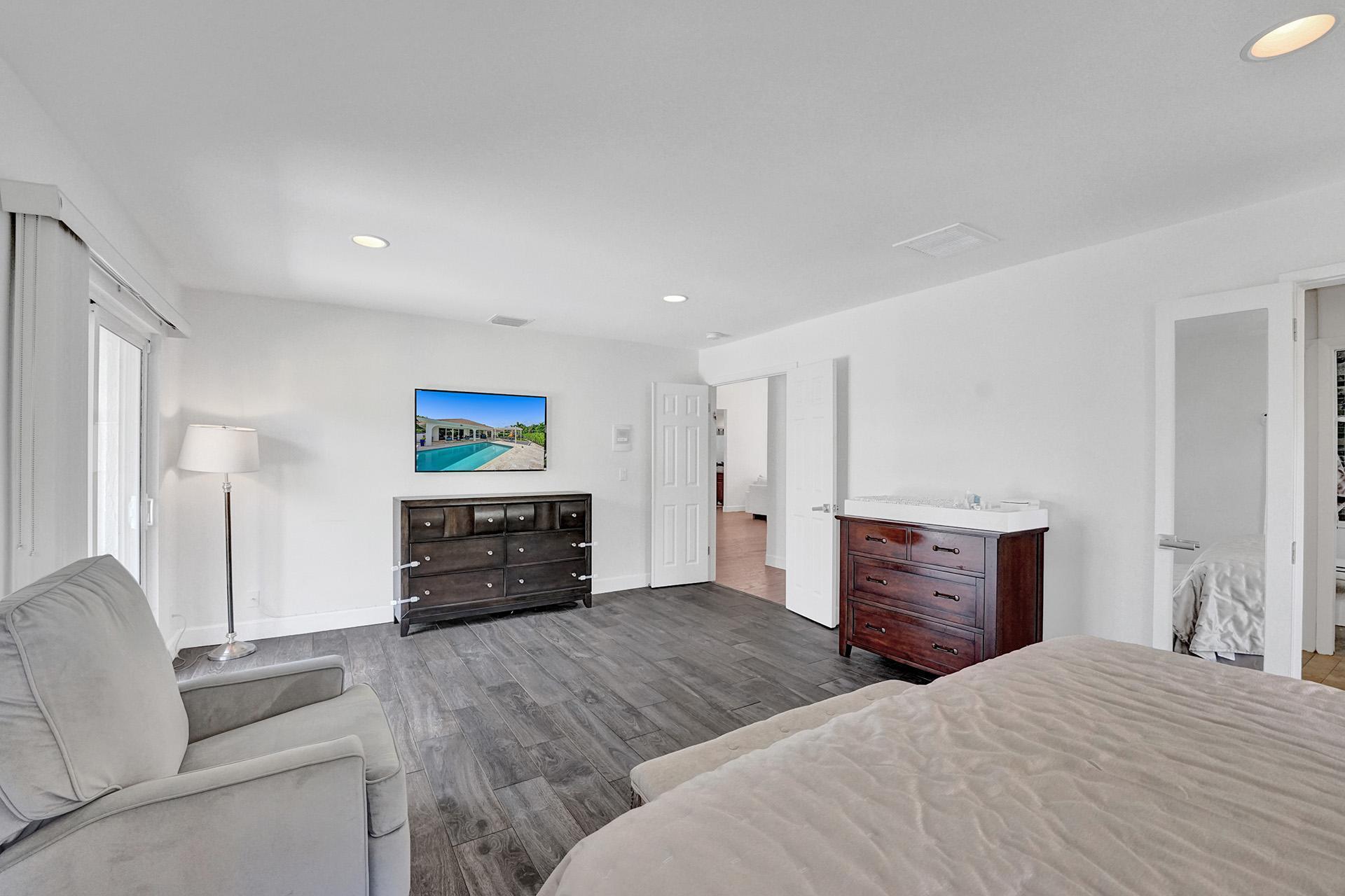 5264 Deerhurst Crescent Circle Boca Raton, FL 33486 - Photo 30 of 62 a bedroom with furniture and dresser