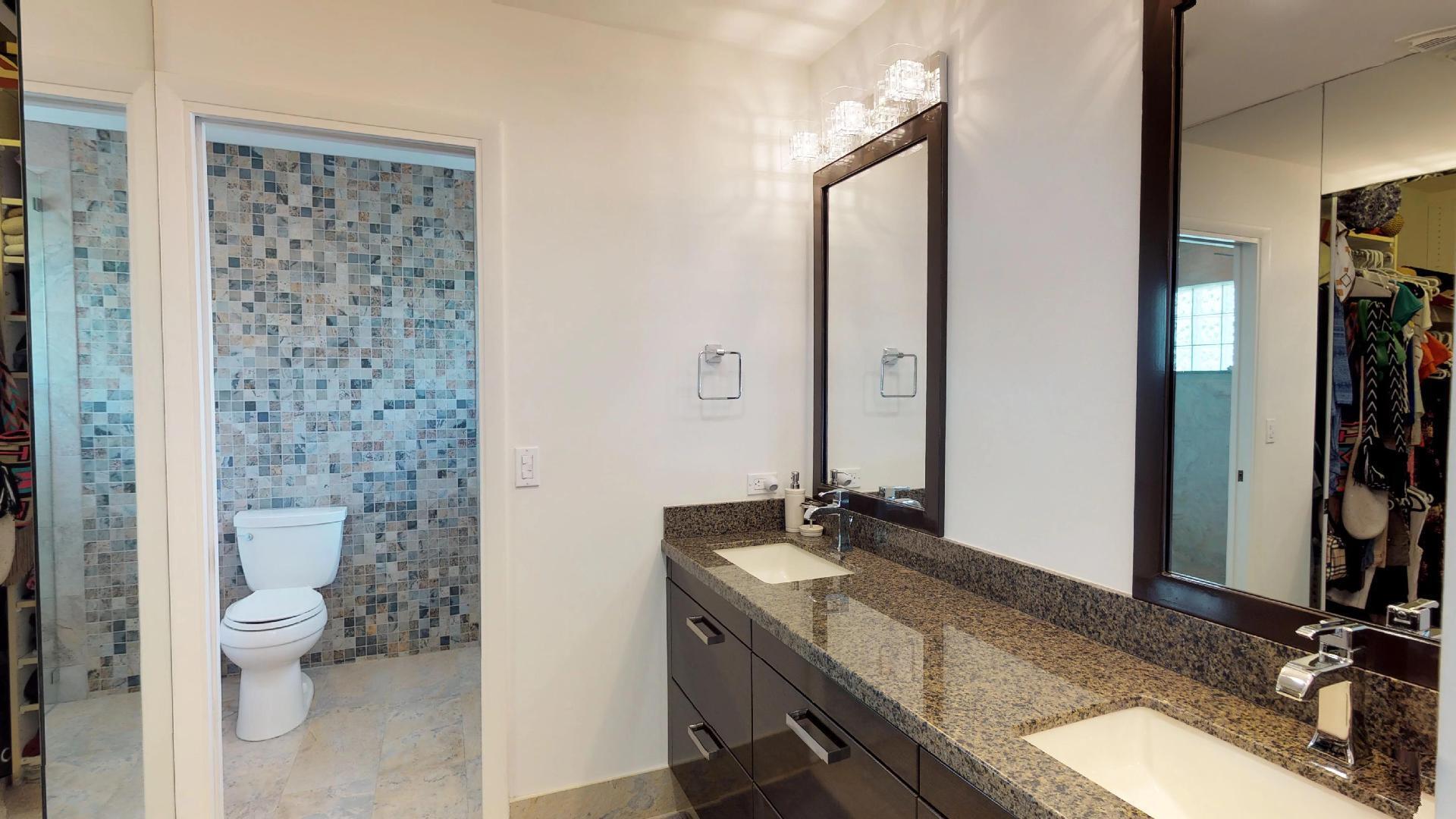 5264 Deerhurst Crescent Circle Boca Raton, FL 33486 - Photo 31 of 62 a bathroom with a granite countertop sink toilet and shower