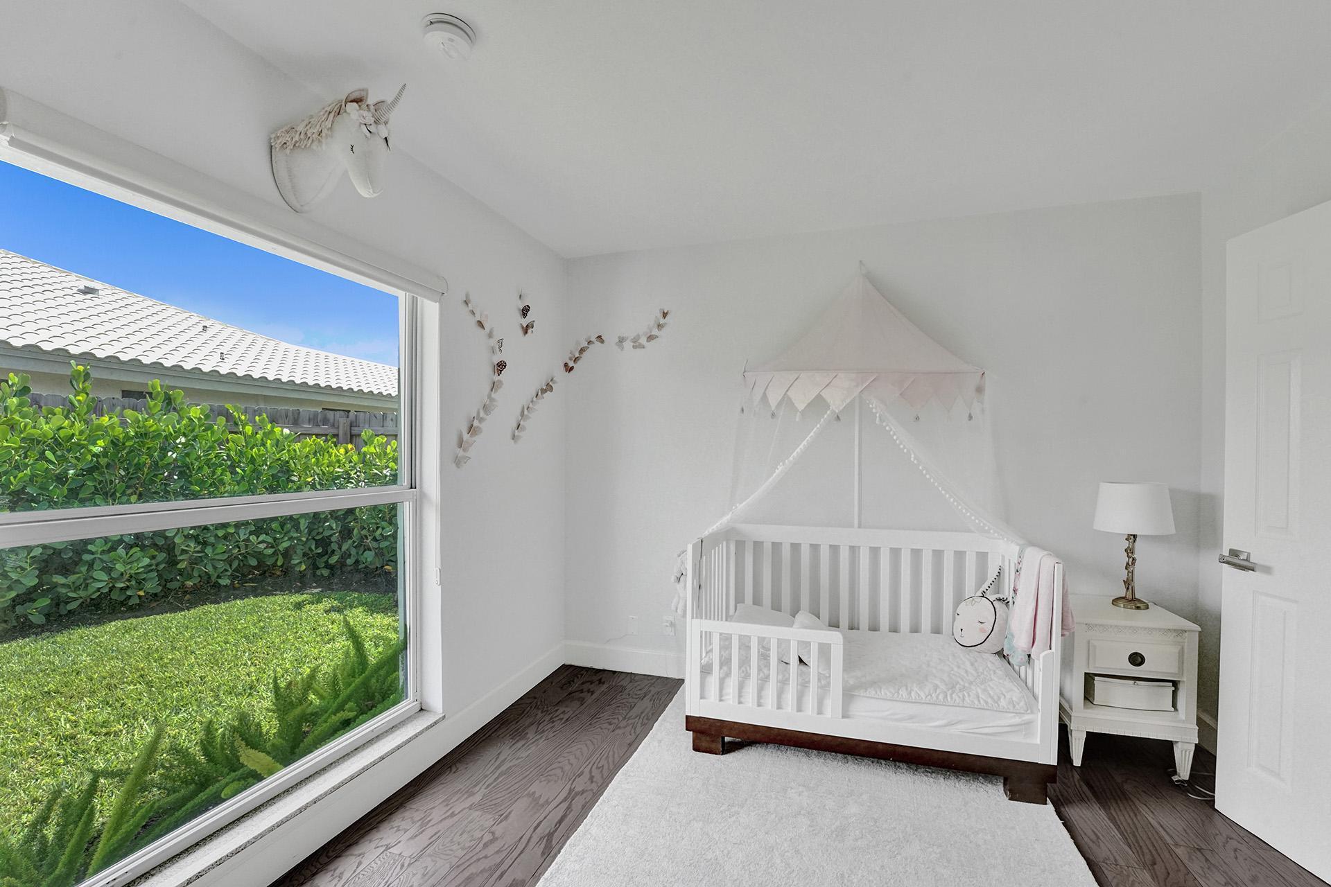 5264 Deerhurst Crescent Circle Boca Raton, FL 33486 - Photo 35 of 62 a view of a bedroom with furniture and windows