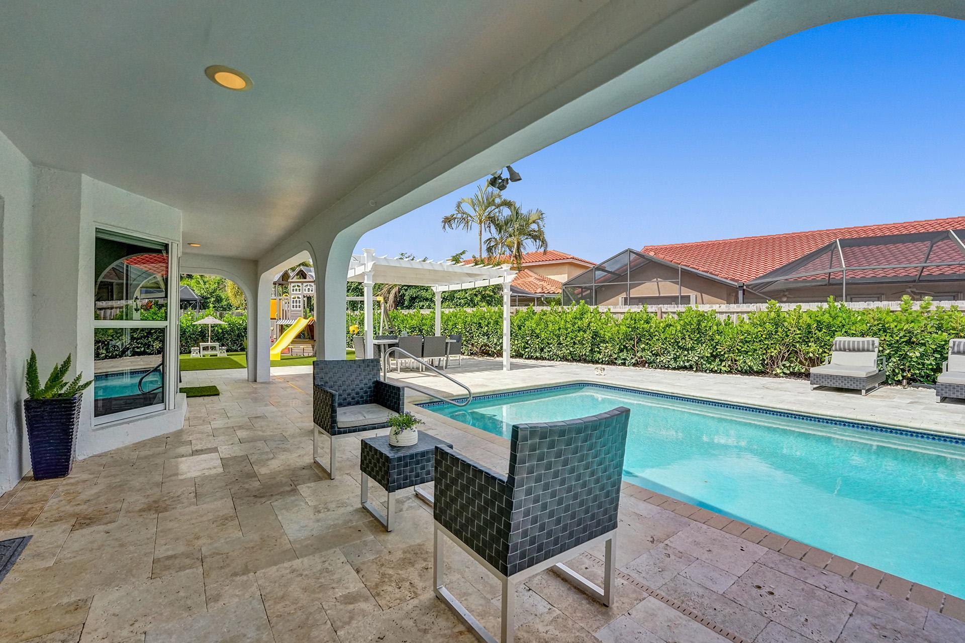 5264 Deerhurst Crescent Circle Boca Raton, FL 33486 - Photo 40 of 62 a outdoor space with patio the couches and pool