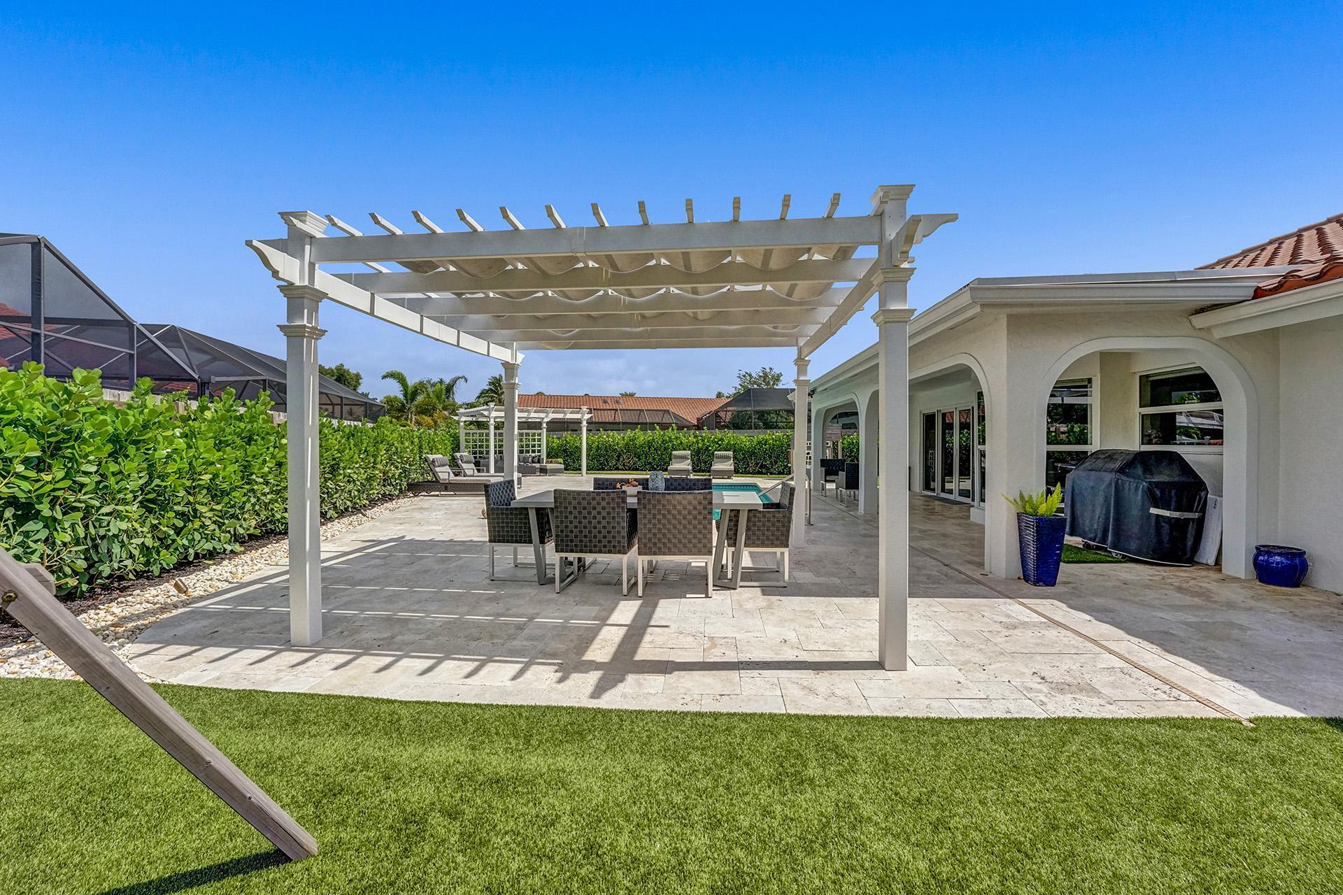 5264 Deerhurst Crescent Circle Boca Raton, FL 33486 - Photo 42 of 62 a view of a patio with a table and chairs