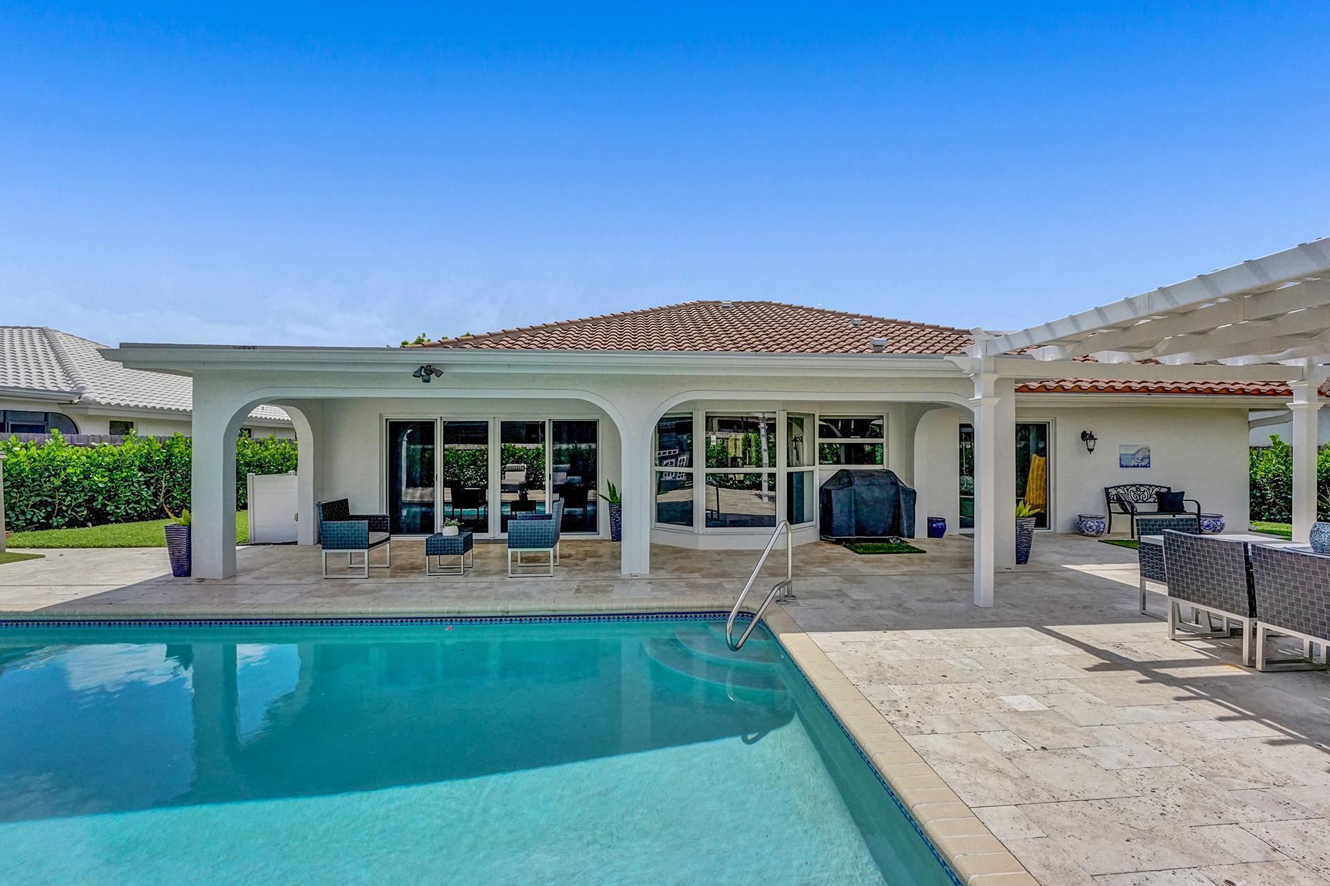 5264 Deerhurst Crescent Circle Boca Raton, FL 33486 - Photo 49 of 62 a front view of house with deck and seating space
