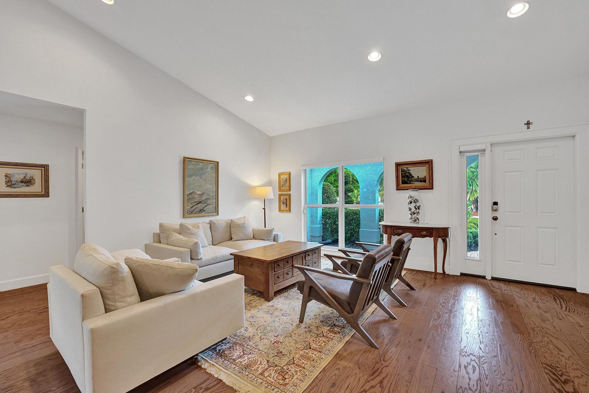 5264 Deerhurst Crescent Circle Boca Raton, FL 33486 - Photo 9 of 62 a living room with furniture and a wooden floor