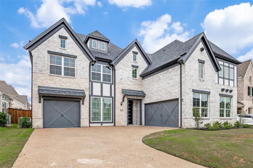 2417 Shane Drive Midlothian, TX 76065 - Photo 1 of 40 a front view of a house with a garden and yard