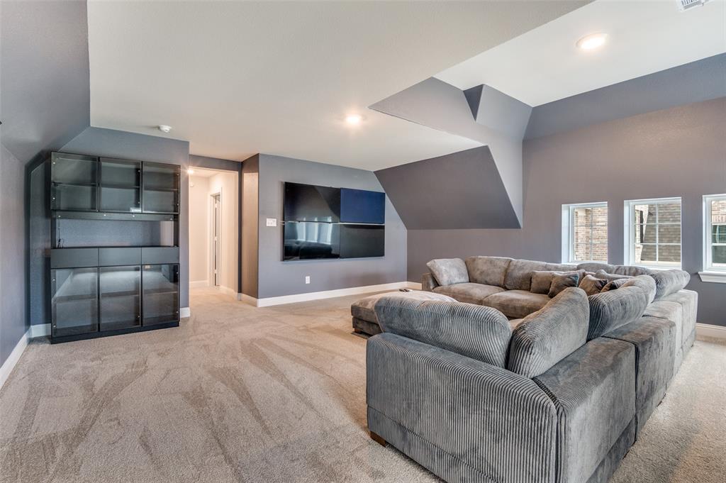 2417 Shane Drive Midlothian, TX 76065 - Photo 18 of 40 a living room with furniture and a flat screen tv
