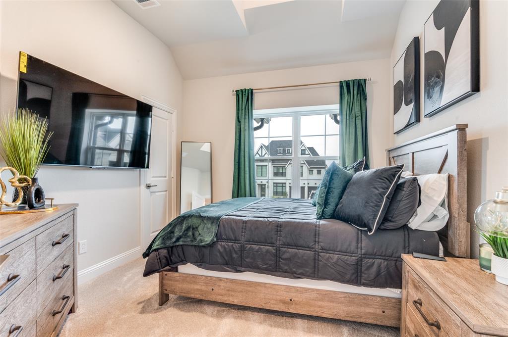 2417 Shane Drive Midlothian, TX 76065 - Photo 23 of 40 a bedroom with a bed window and mirror