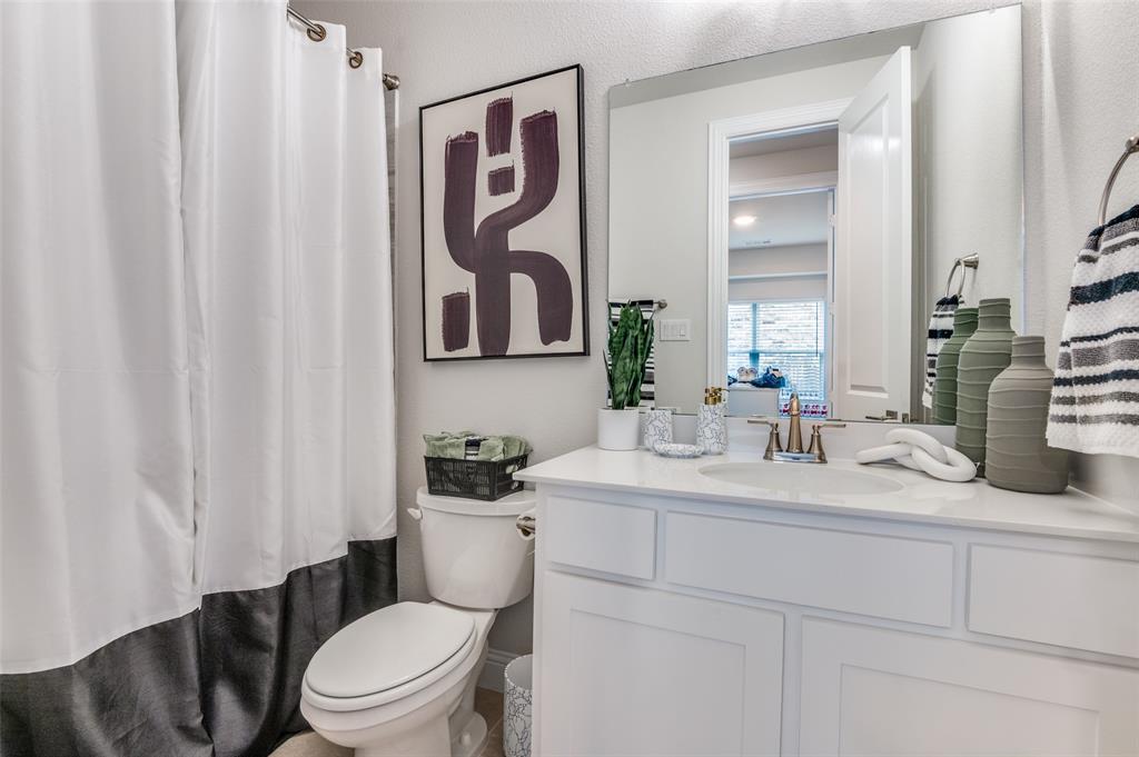 2417 Shane Drive Midlothian, TX 76065 - Photo 28 of 40 a bathroom with a toilet sink and mirror