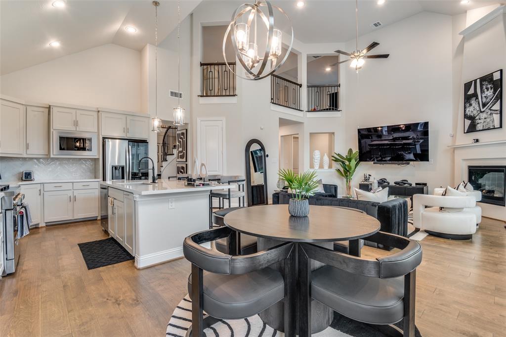 2417 Shane Drive Midlothian, TX 76065 - Photo 8 of 40 a kitchen with a dining table chairs and microwave