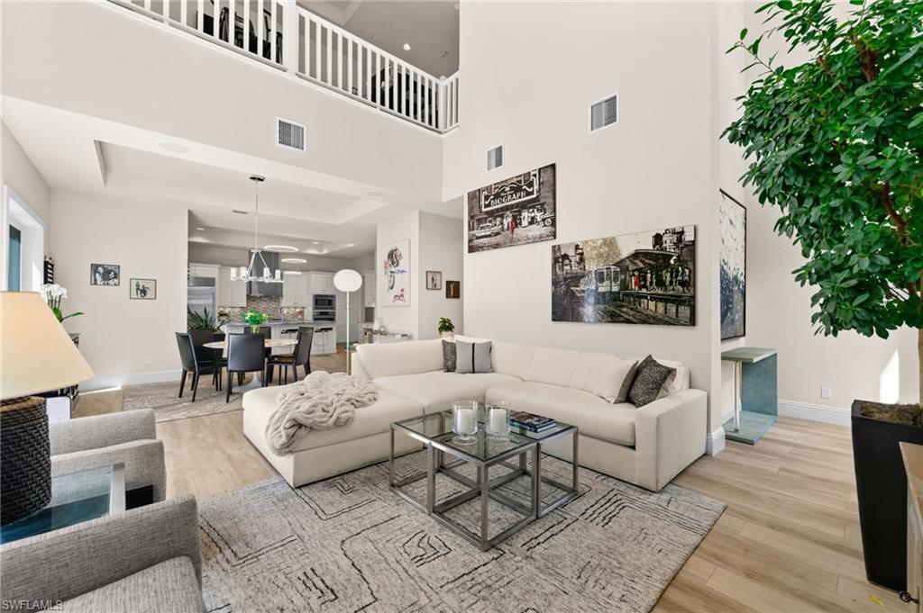 9172 Mercato Lane Naples, FL 34108 - Photo 11 of 29 Living area featuring light wood-type flooring and baseboards