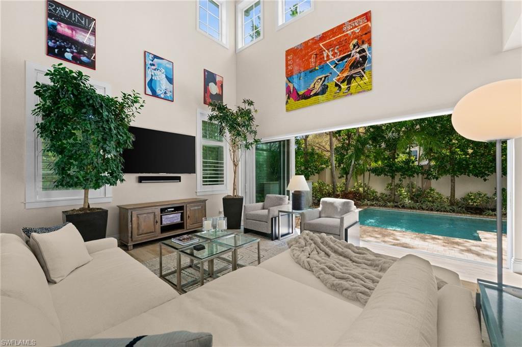 9172 Mercato Lane Naples, FL 34108 - Photo 12 of 29 Living area featuring a high ceiling
