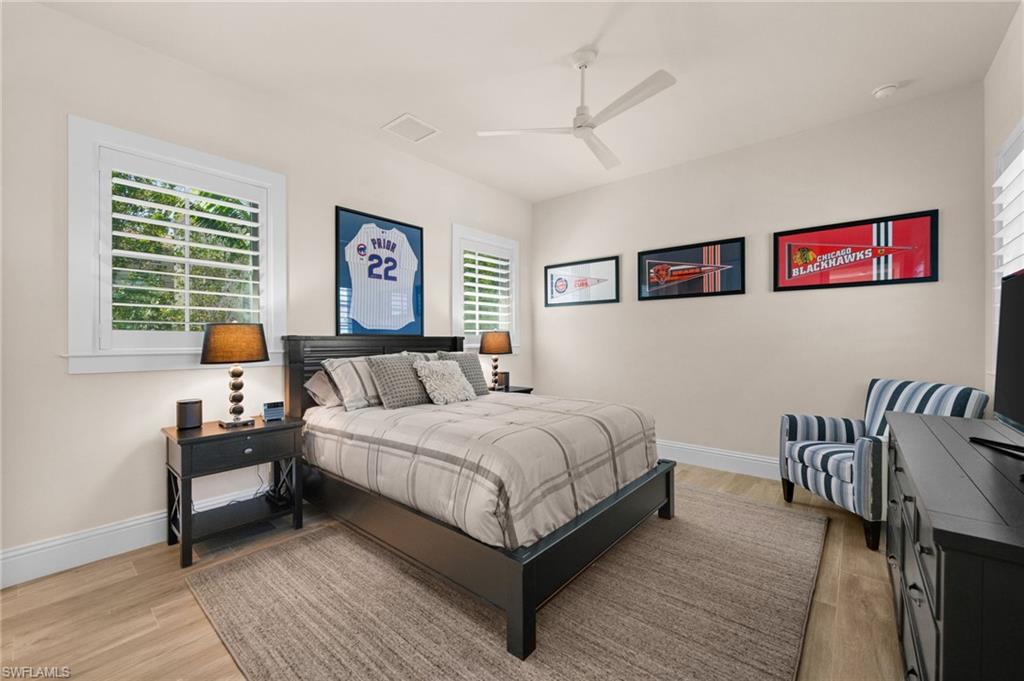 9172 Mercato Lane Naples, FL 34108 - Photo 20 of 29 Bedroom featuring light wood-style floors and ceiling fan
