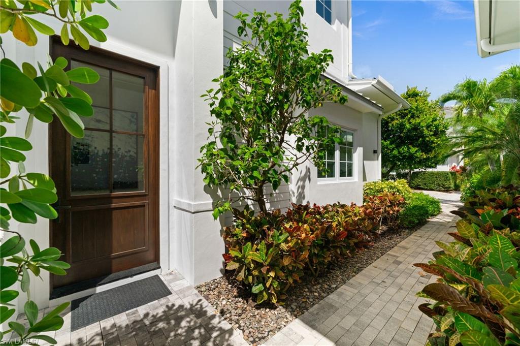 9172 Mercato Lane Naples, FL 34108 - Photo 3 of 29 View of exterior entry featuring stucco siding