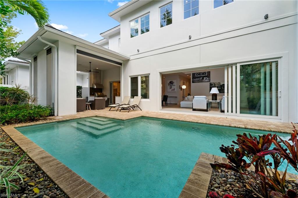 9172 Mercato Lane Naples, FL 34108 - Photo 4 of 29 Rear view of house featuring an outdoor pool, a patio area, stucco siding, and ceiling fan