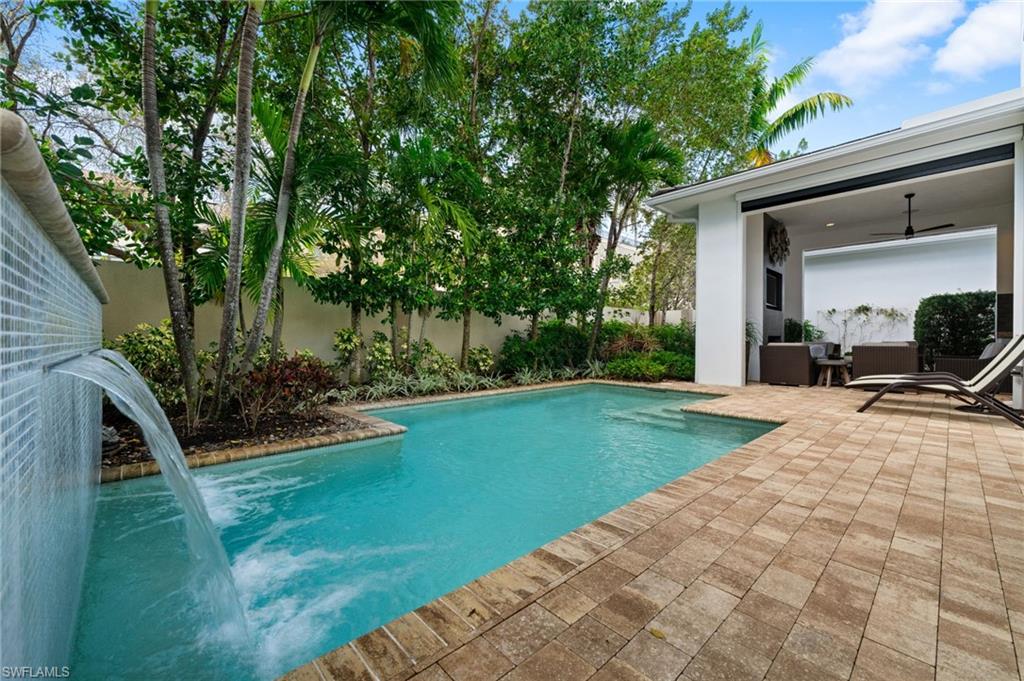 9172 Mercato Lane Naples, FL 34108 - Photo 5 of 29 View of swimming pool featuring patio surround and a fenced backyard