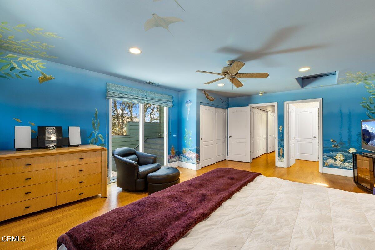 4530 Lyme Bay Oxnard, CA 93035 - Photo 18 of 46 a bedroom with a bed and wooden floor