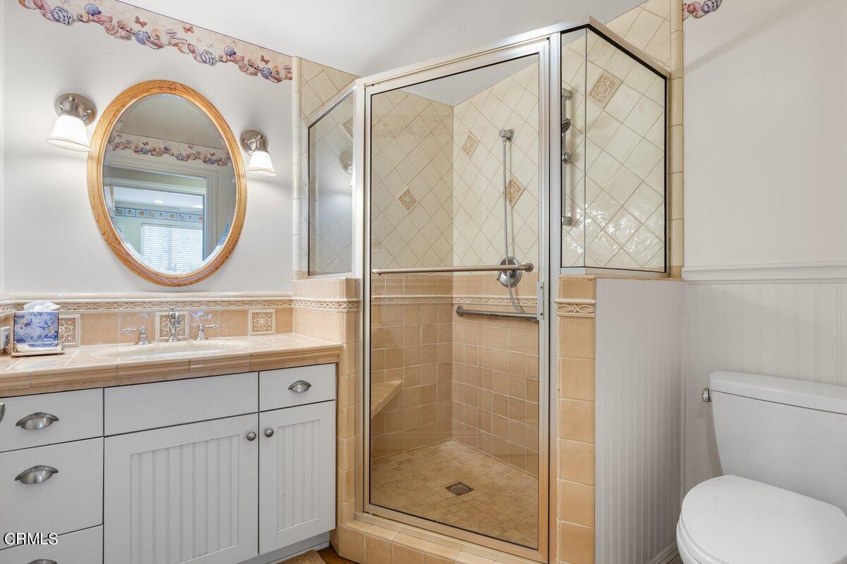 4530 Lyme Bay Oxnard, CA 93035 - Photo 32 of 46 a bathroom with a granite countertop sink mirror vanity and toilet