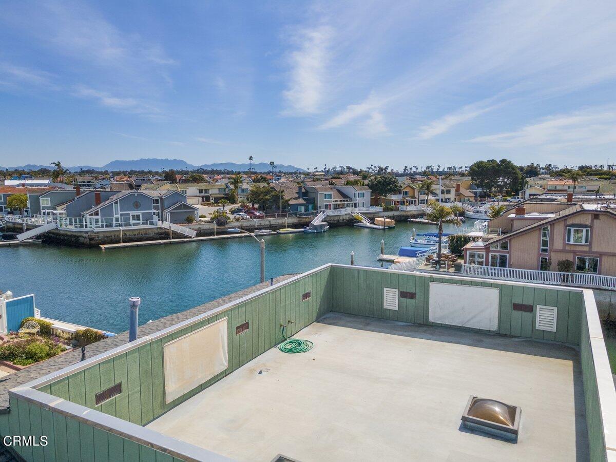 4530 Lyme Bay Oxnard, CA 93035 - Photo 37 of 46 a terrace with a bench and lake view