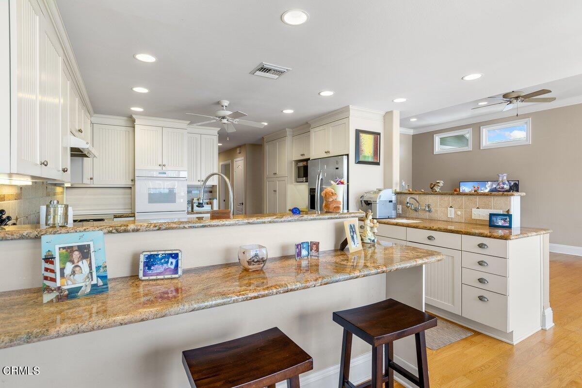 4530 Lyme Bay Oxnard, CA 93035 - Photo 9 of 46 a kitchen with counter top space and appliances