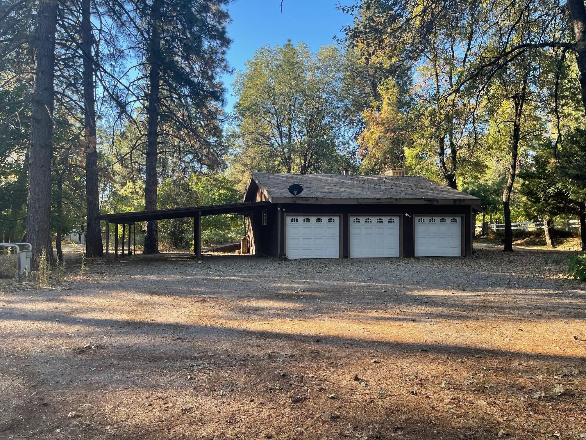 21565 Riverview Drive Lakehead, CA 96051 - Photo 2 of 6 a view of a house with a yard and tree s