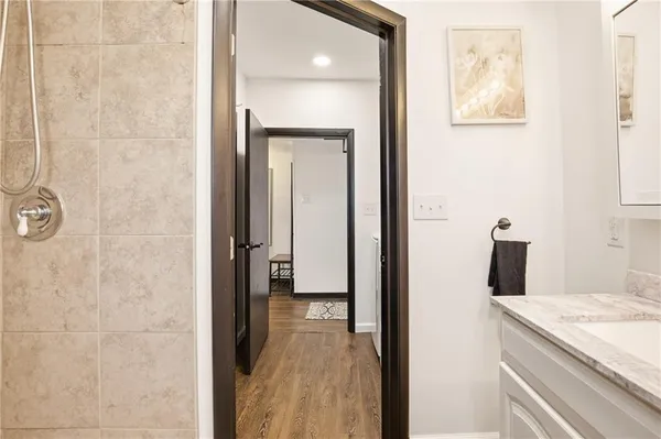 a view of a bathroom from the hallway