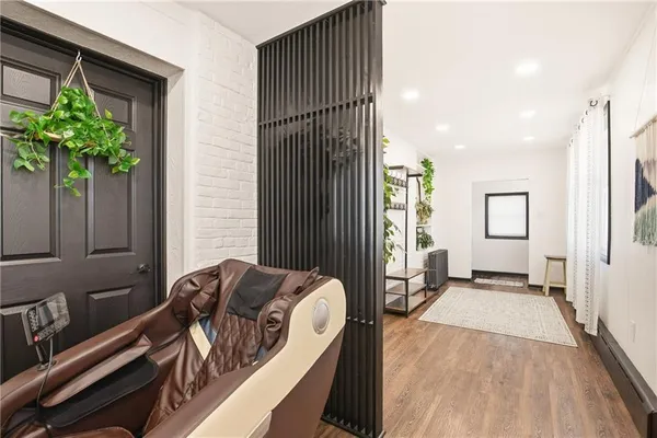 a bed room with a bed and a potted plant