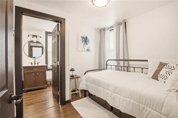 a bedroom with a bed and a dresser