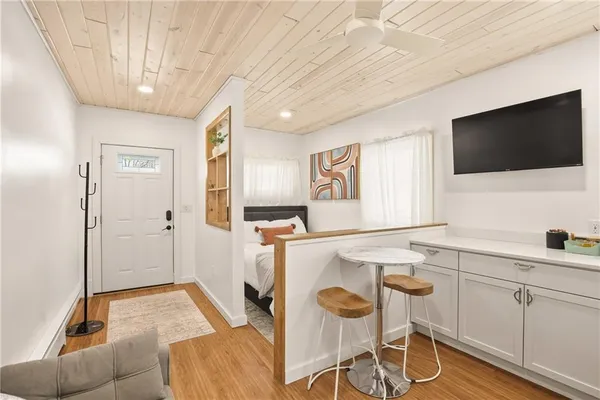 a bedroom with a large bed and a window