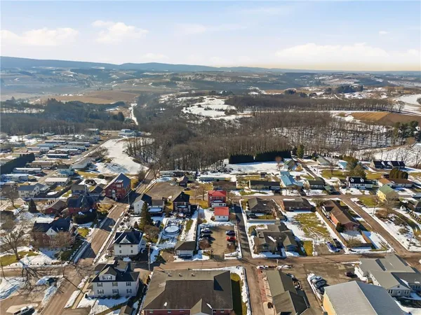 an aerial view of residential building with parking