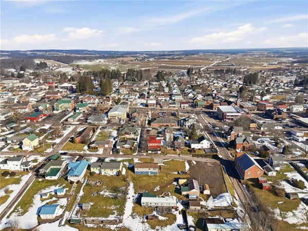 an aerial view of residential building with parking