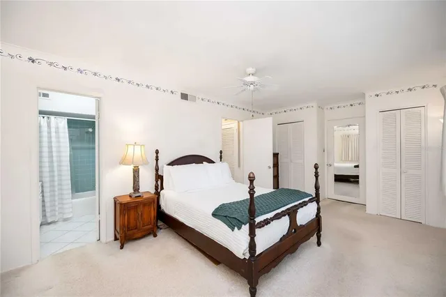 a bedroom with a bed and a table