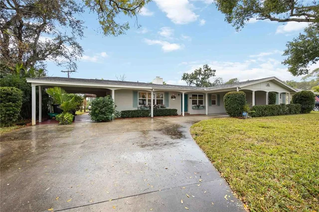 a view of house with yard