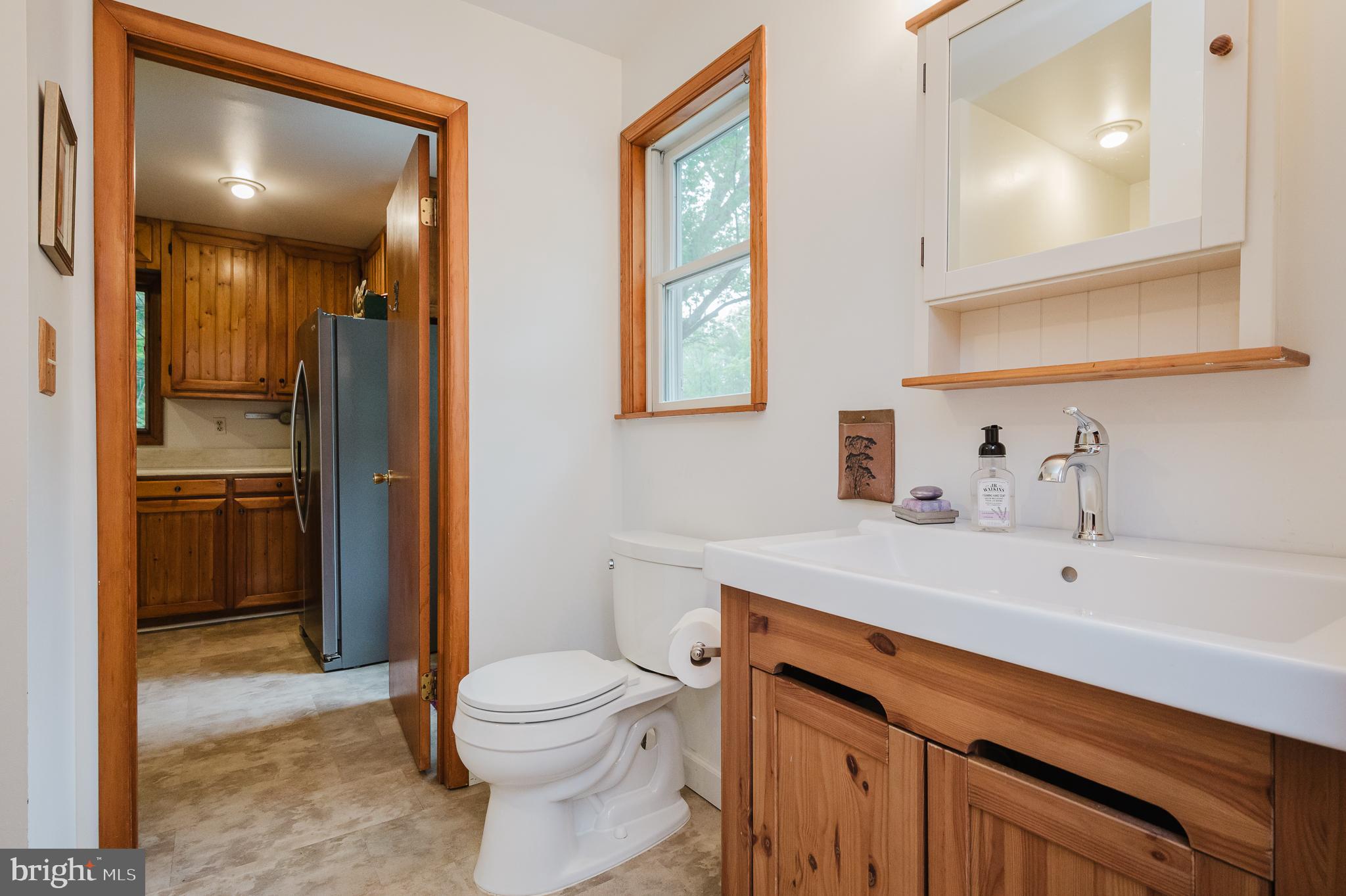 710 Magnolia Road Joppa, MD 21085 - Photo 16 of 58 a bathroom with a sink a toilet and shower