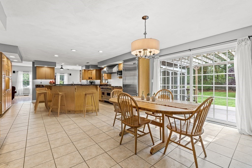 7 Cynthia Road Billerica, MA 01821 - Photo 10 of 41 a dining room with furniture a chandelier and kitchen view