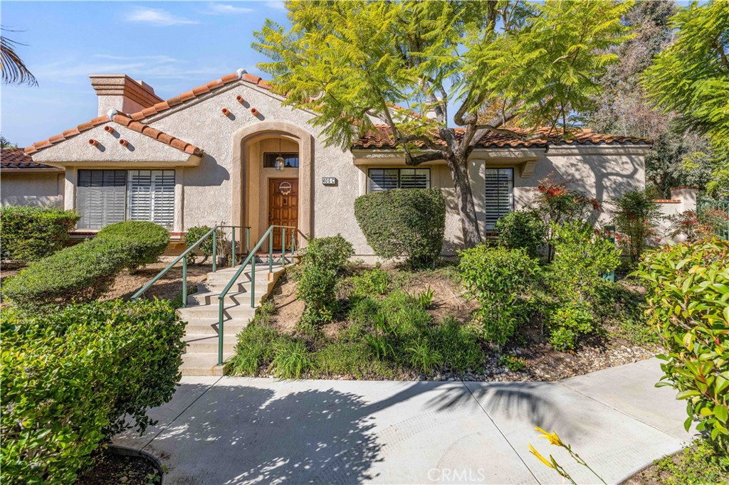 406 Country Club Drive Simi Valley, CA 93065 - Photo 1 of 56 front view of a house with a yard