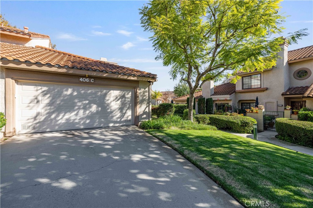 406 Country Club Drive Simi Valley, CA 93065 - Photo 17 of 56 a view of a house with a yard