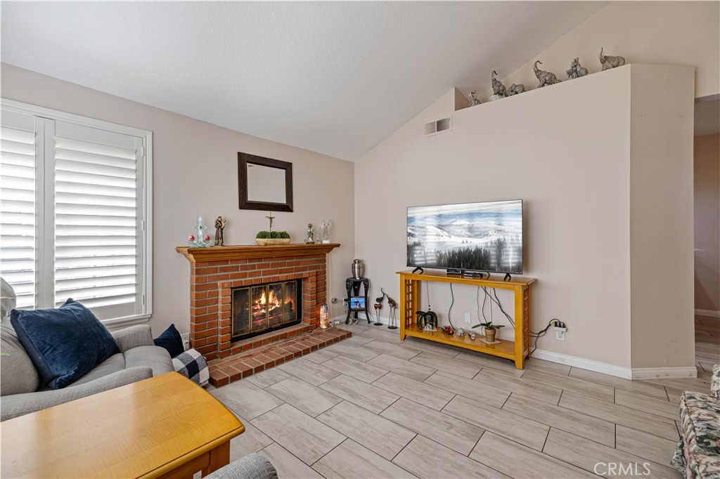 406 Country Club Drive Simi Valley, CA 93065 - Photo 19 of 56 a living room with furniture and a fireplace