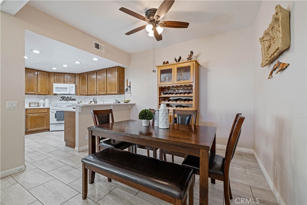 406 Country Club Drive Simi Valley, CA 93065 - Photo 25 of 56 a view of a dining room with furniture