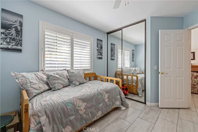 a bedroom with a bed and a dresser