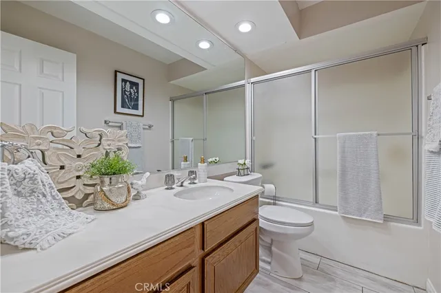 a bathroom with a double vanity sink and mirror